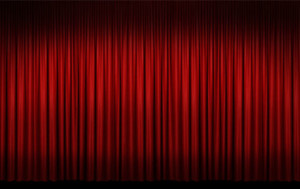 Red stage curtains closed.