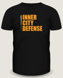 Black t-shirt mockup design for Inner City Defense using their company logo.